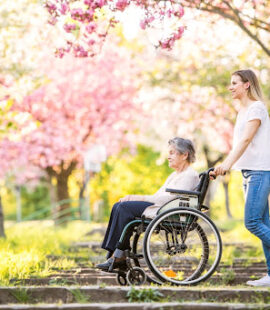 A woman pushing an incapacitated trust grantor in a wheelchair who was rendered incapacitated under California probate law.