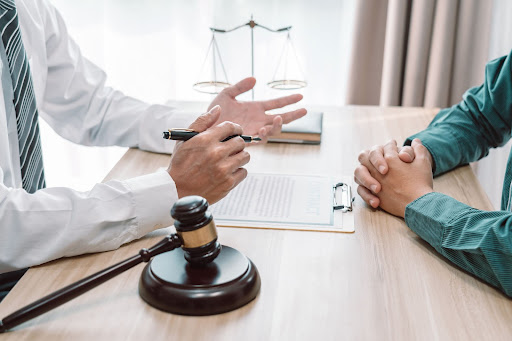 A trust lawyer consulting with a client and discussing their best course of action for a trust dispute.