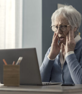 An elderly woman in shock after falling victim to elder financial abuse in California and becoming yet another number in elder abuse statistics from 2022.