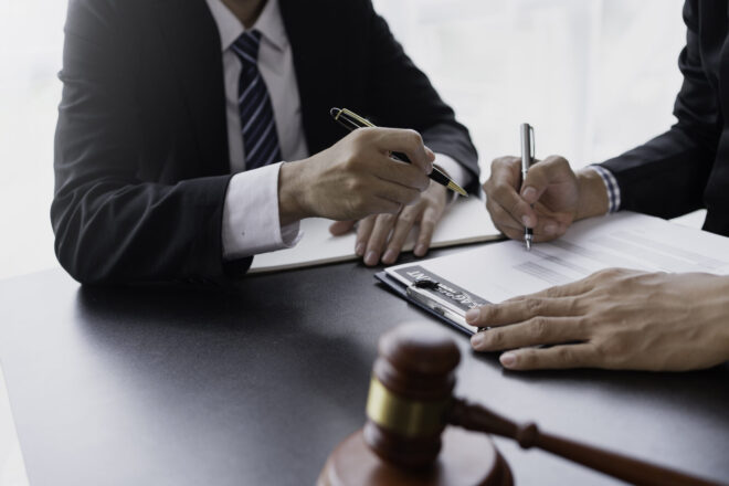 California trust litigation lawyer working with a client to determine if a fiduciary violated their trustee duties in California.