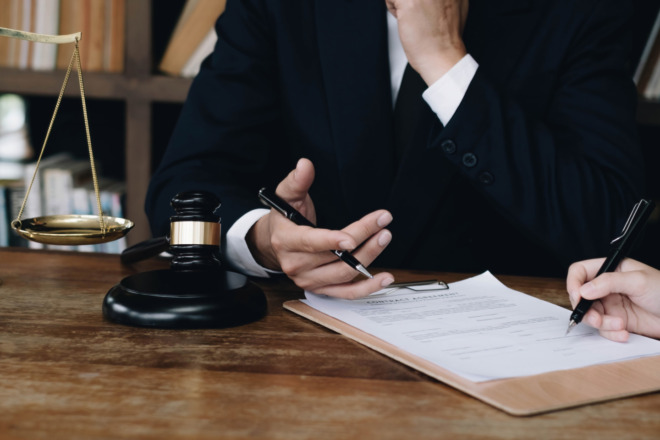An attorney going over a case and collecting the testimonial evidence they need, which is a vital part of answering, How do you prove a breach of fiduciary duty?