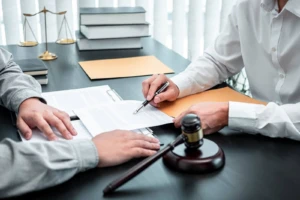 Lawyers reviewing documents to find a strategy when determining how to invalidate a trust for a client.