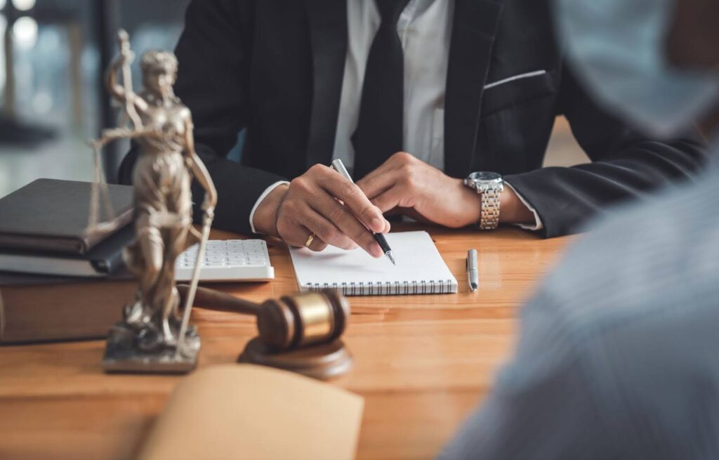 An attorney going over California inheritance law with a client and discussing their case.