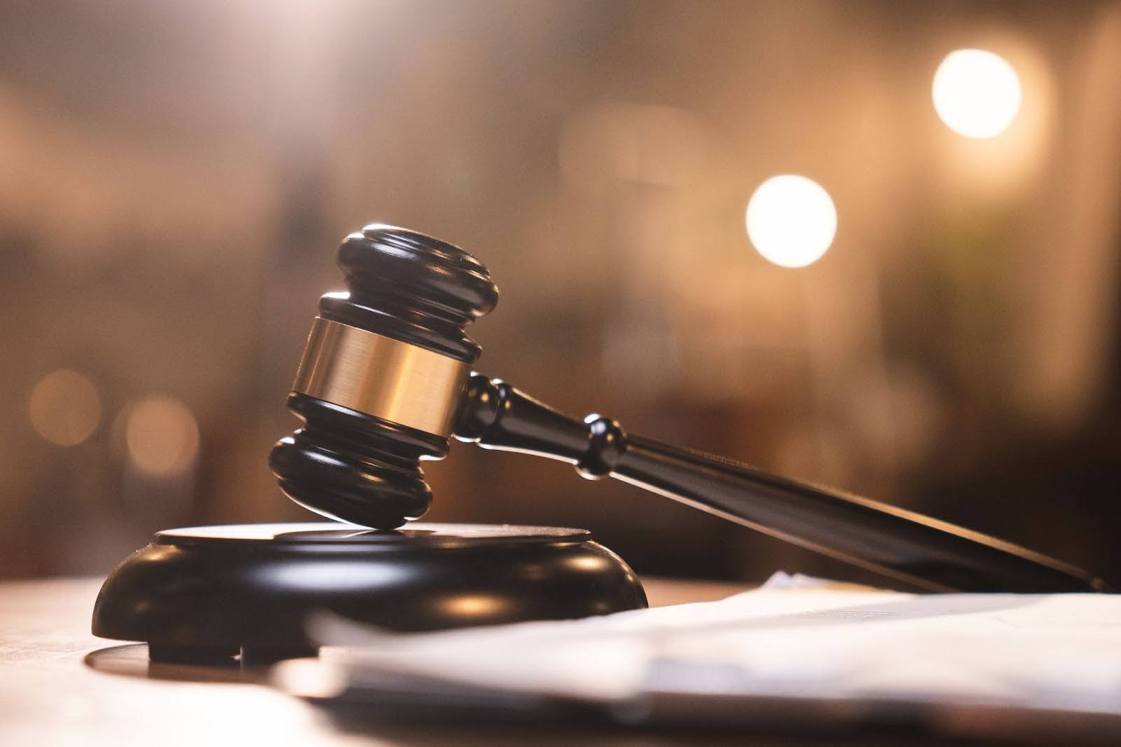 A gavel in a courtroom, a fitting symbol for your potential recourse after answering the question, How long does a trustee have to settle a trust in California?
