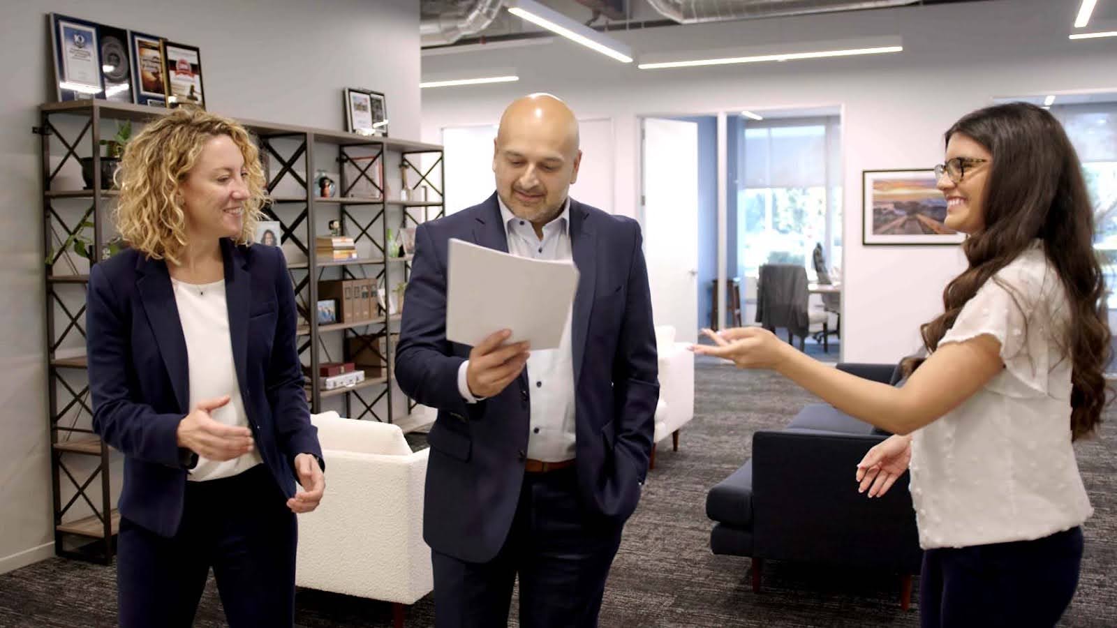 A team of lawyers going over a document to answer the question, Who can contest a trust in California?