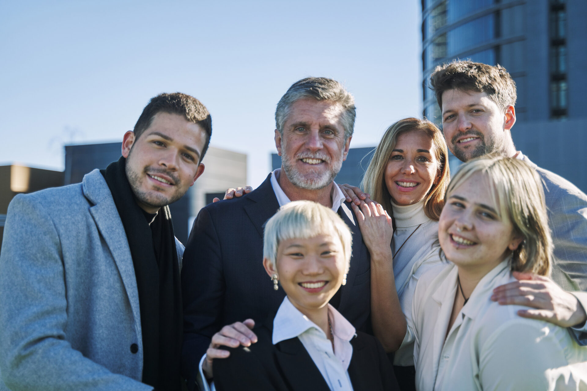 A family that is smiling because they have addressed all the common pitfalls of inheriting a family business in California.