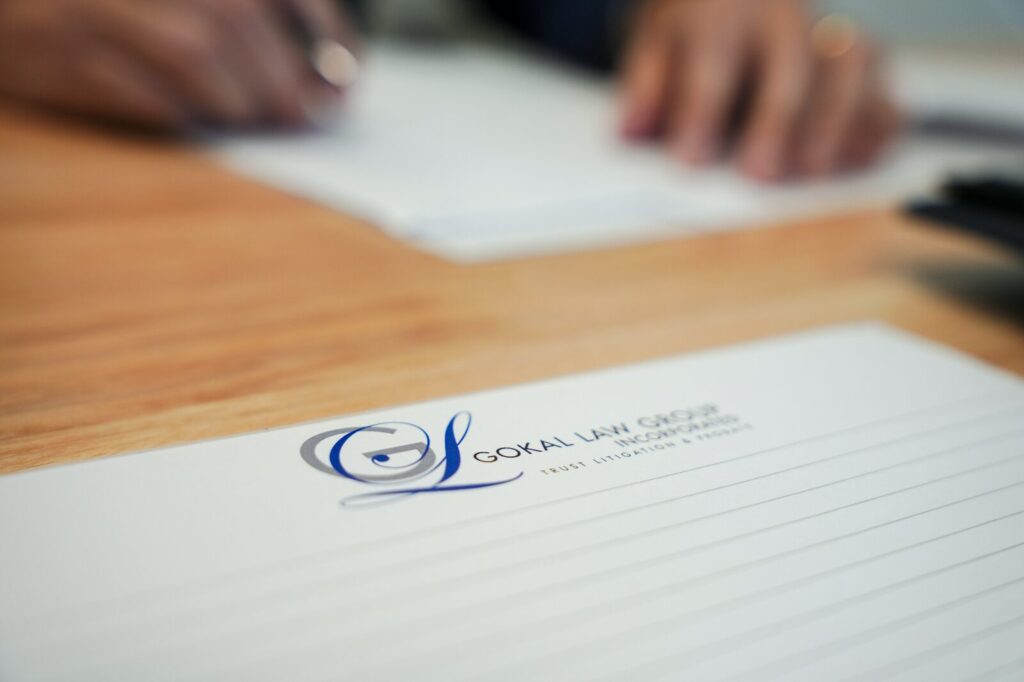 A picture of someone taking notes about a case on Gokal Law Group letterhead that revolves around the question, Can a trustee borrow money from a trust in California?